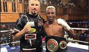 Sbu and trainer with the belt after the fight